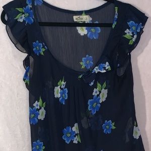 Sheer blue floral print with bow on the front.